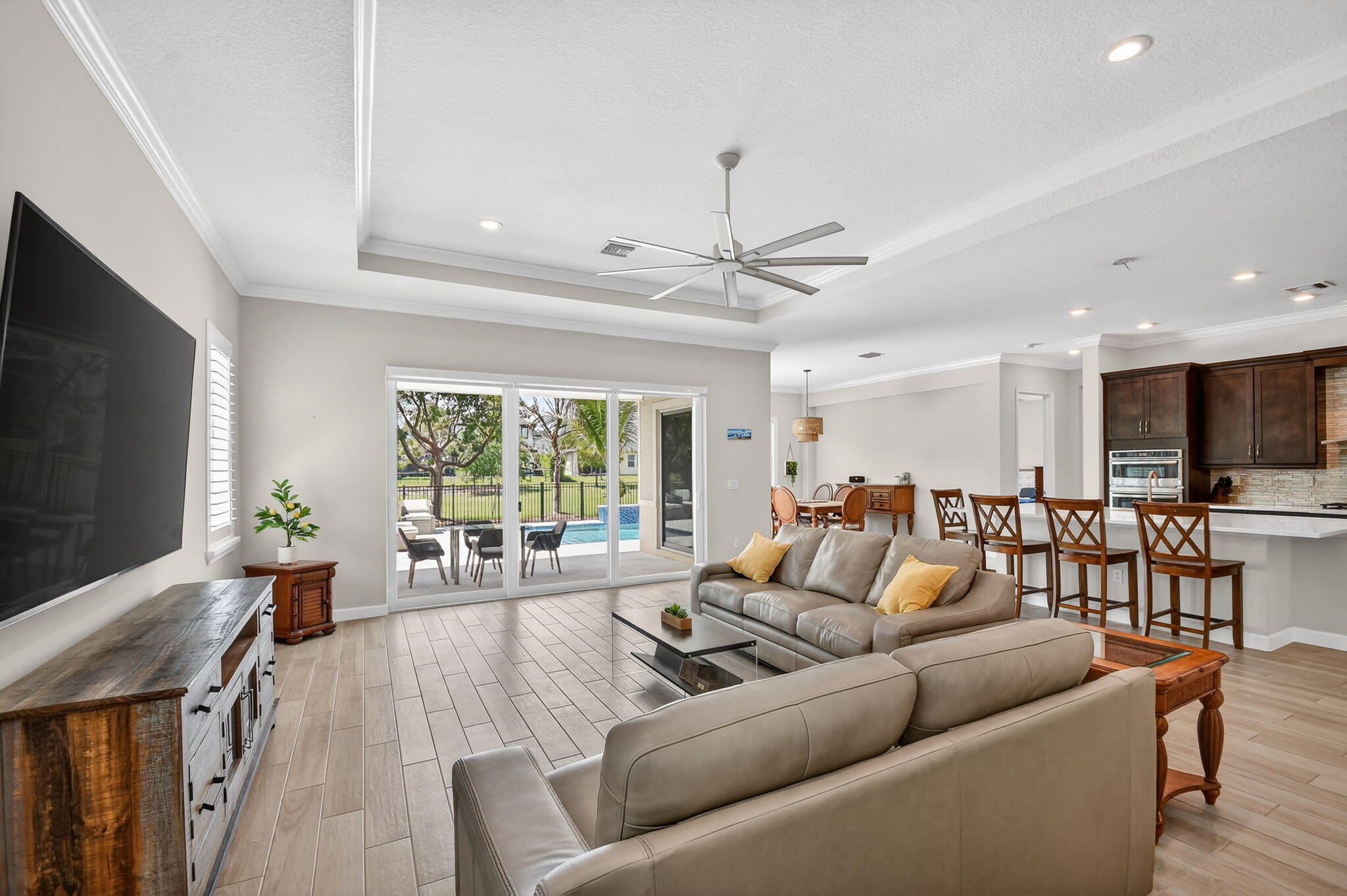 1055 Ember Ridge Run Loxahatchee, FL 33470 - Photo 15 of 103 a living room with furniture and a flat screen tv