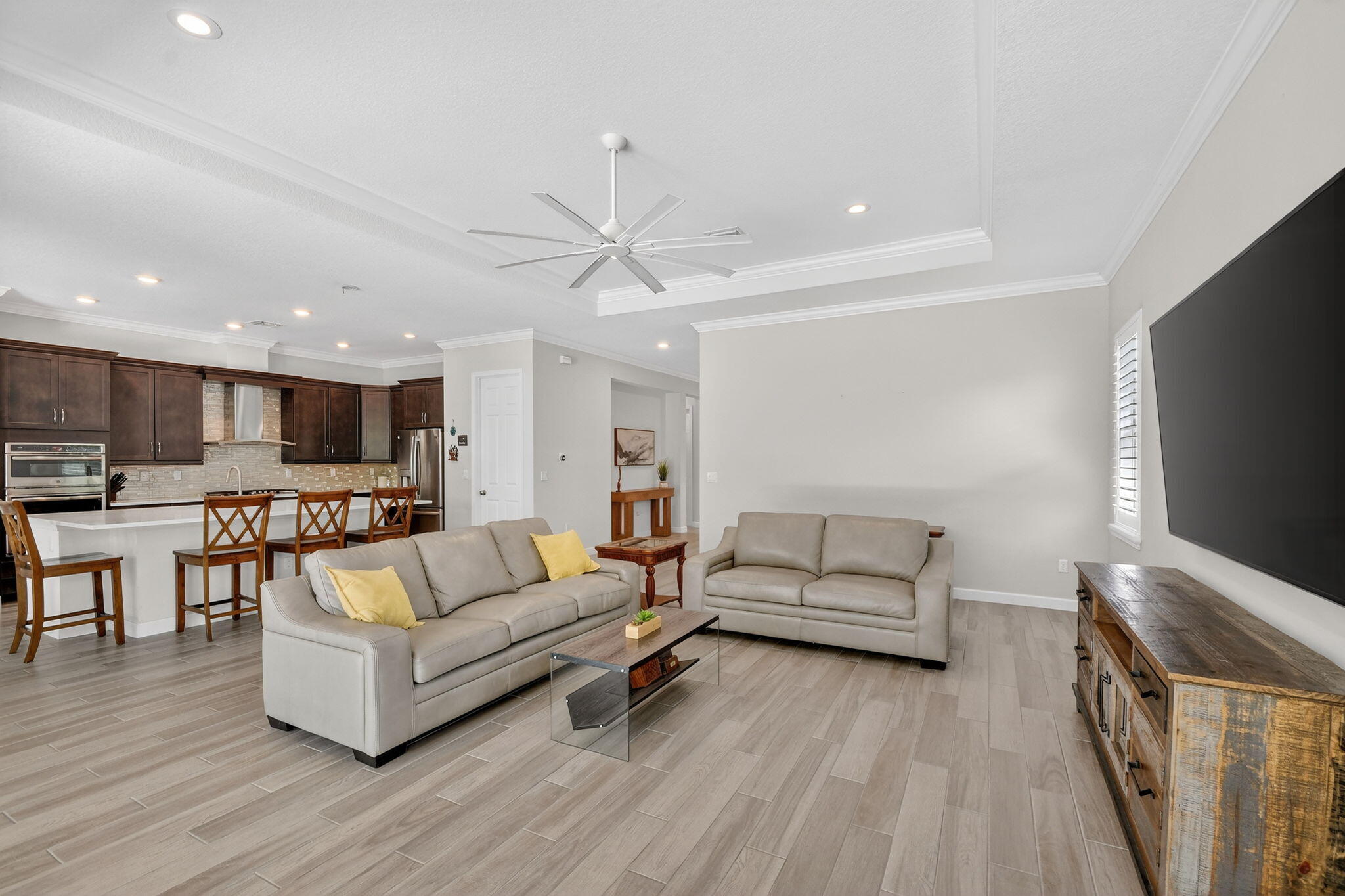 1055 Ember Ridge Run Loxahatchee, FL 33470 - Photo 17 of 103 a living room with furniture and a flat screen tv