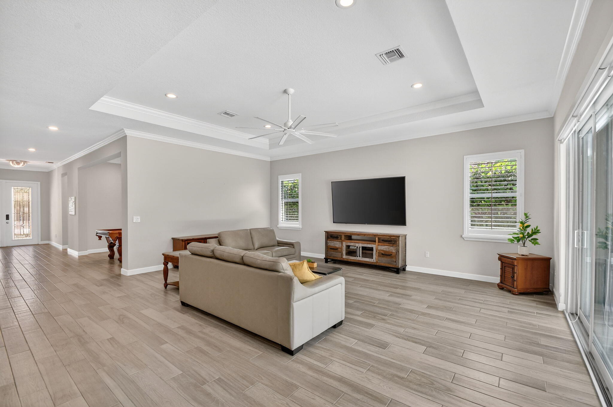 1055 Ember Ridge Run Loxahatchee, FL 33470 - Photo 18 of 103 a living room with furniture and a flat screen tv