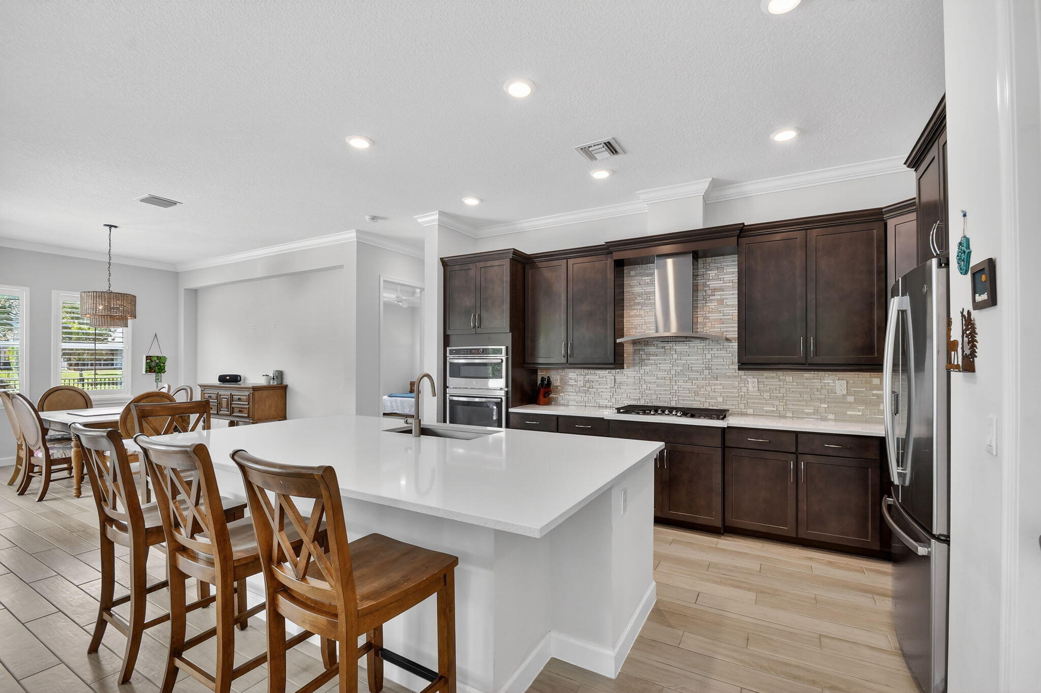 1055 Ember Ridge Run Loxahatchee, FL 33470 - Photo 19 of 103 a kitchen with lots of counter top space and appliances