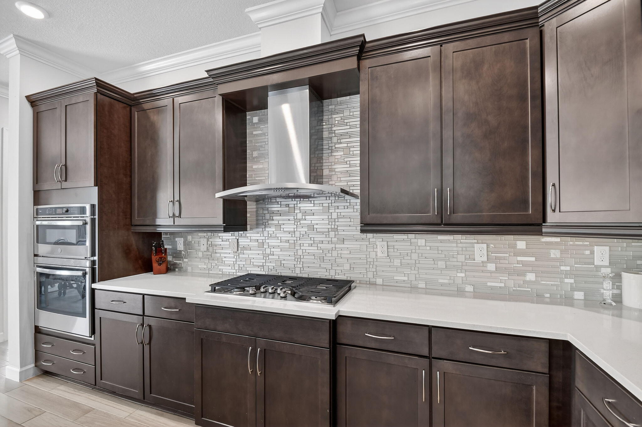 1055 Ember Ridge Run Loxahatchee, FL 33470 - Photo 20 of 103 a kitchen with stainless steel appliances granite countertop a sink stove and refrigerator
