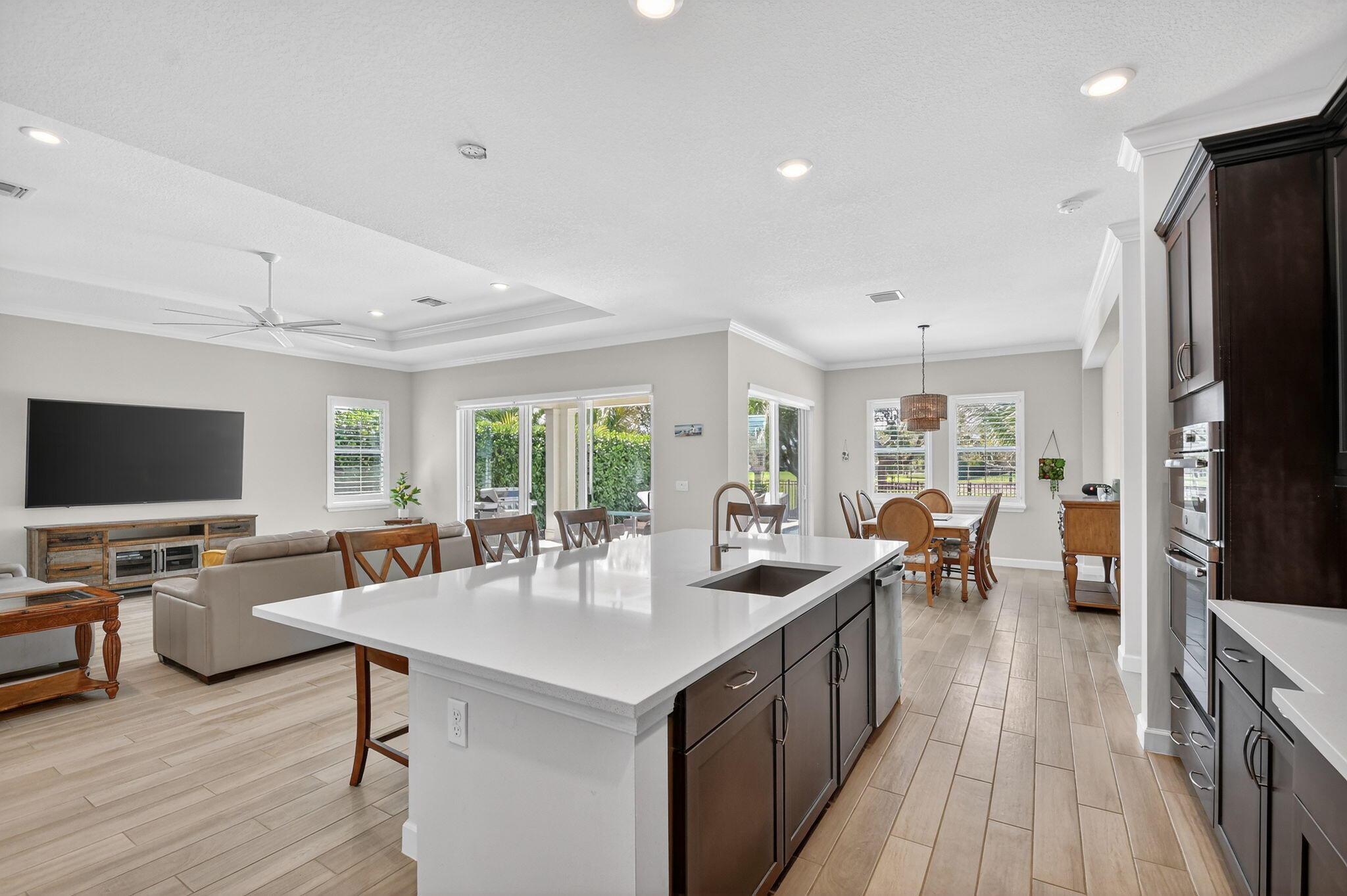 1055 Ember Ridge Run Loxahatchee, FL 33470 - Photo 21 of 103 a view of a dining room with furniture window and wooden floor