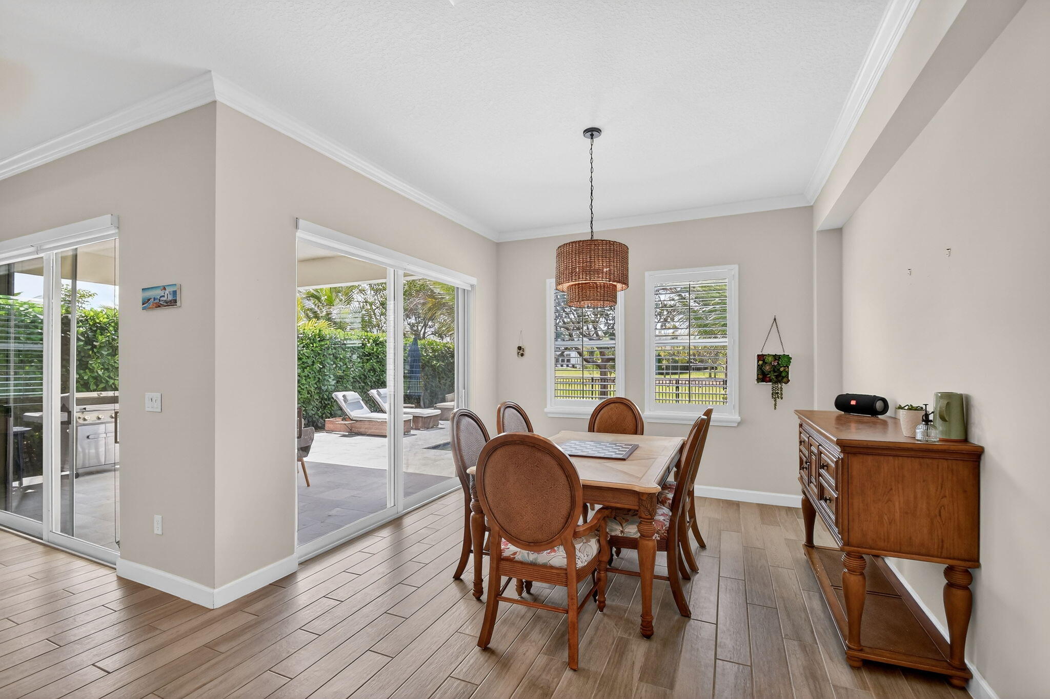 1055 Ember Ridge Run Loxahatchee, FL 33470 - Photo 25 of 103 a view of a dining room with furniture window and outside view