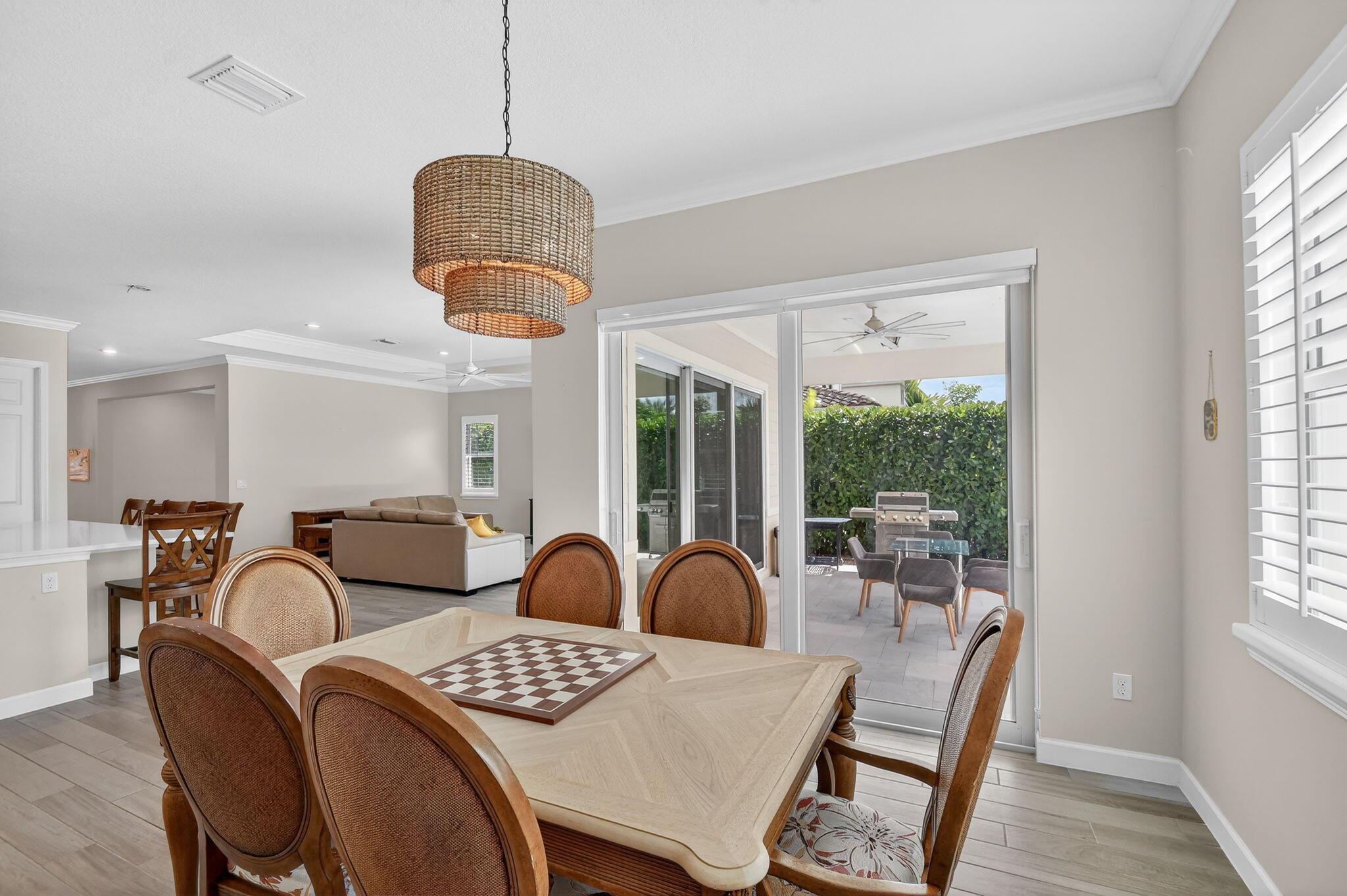 1055 Ember Ridge Run Loxahatchee, FL 33470 - Photo 26 of 103 a view of a dining room with furniture window and outside view