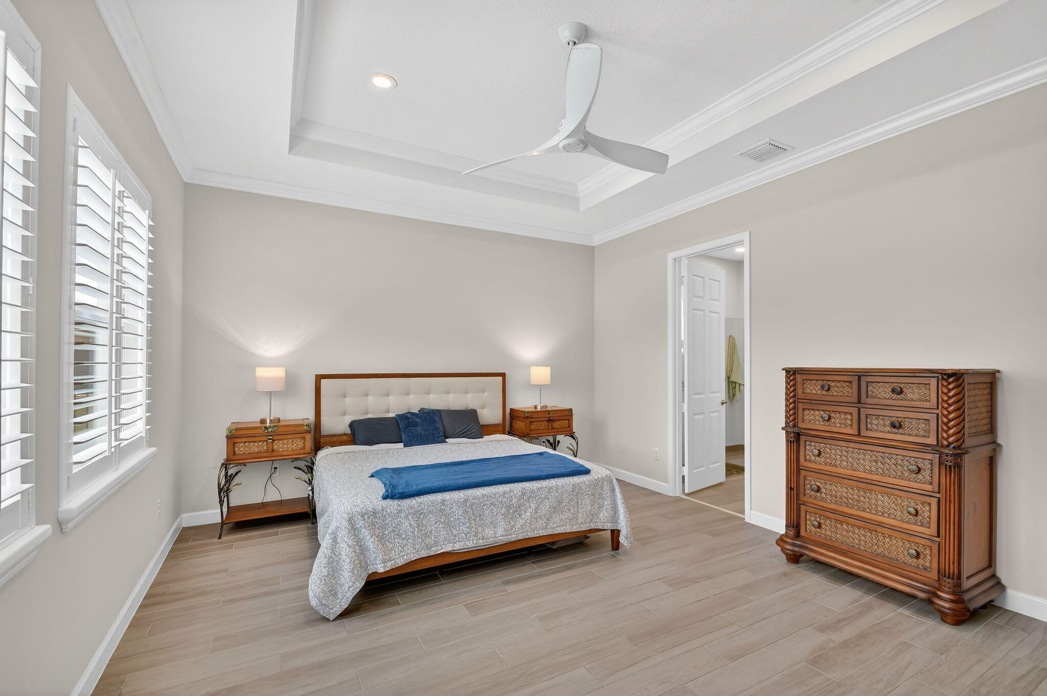 1055 Ember Ridge Run Loxahatchee, FL 33470 - Photo 28 of 103 a bedroom with a bed and a dresser