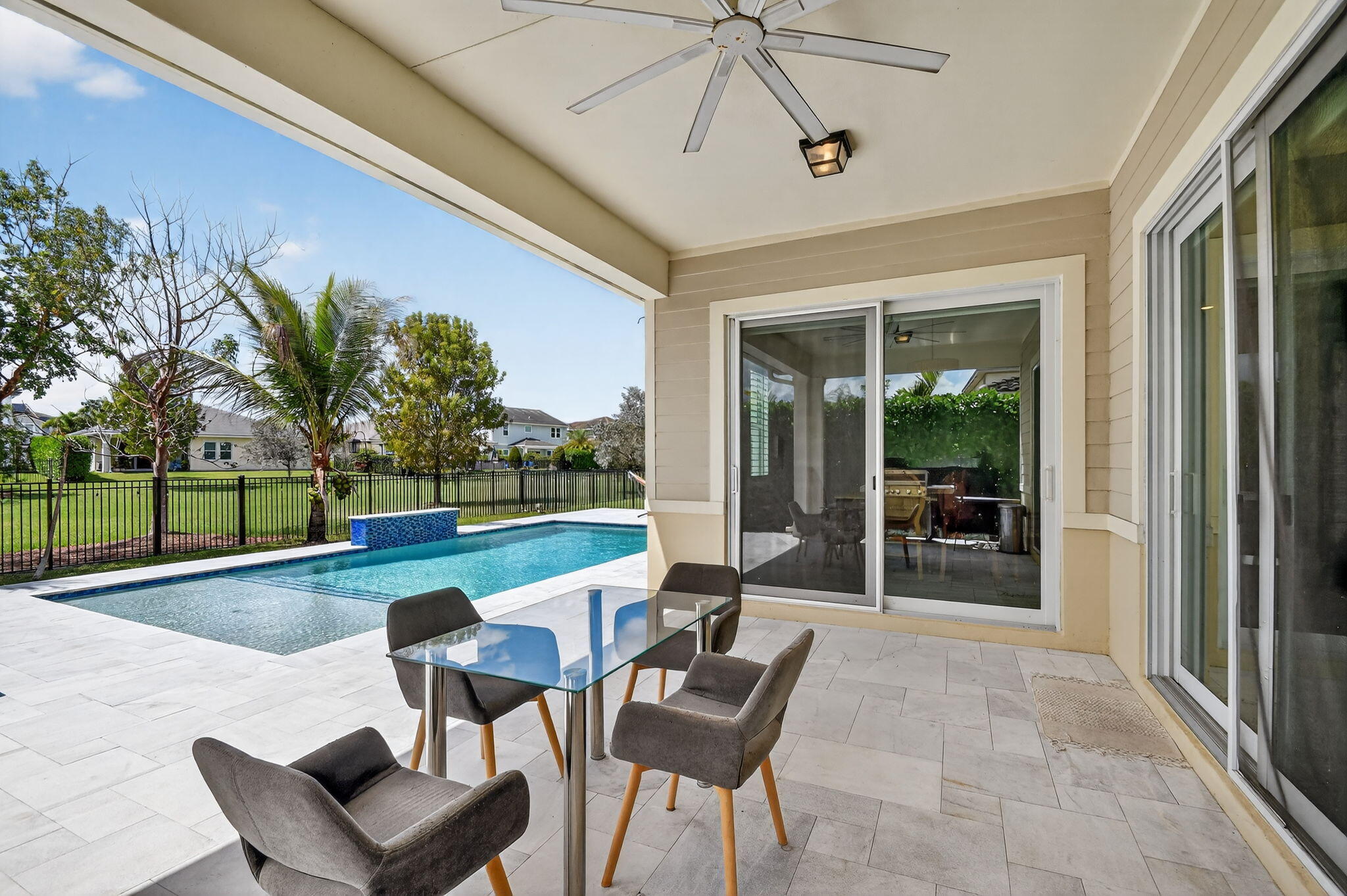 1055 Ember Ridge Run Loxahatchee, FL 33470 - Photo 47 of 103 a outdoor space with patio the couches and a dining table with garden view