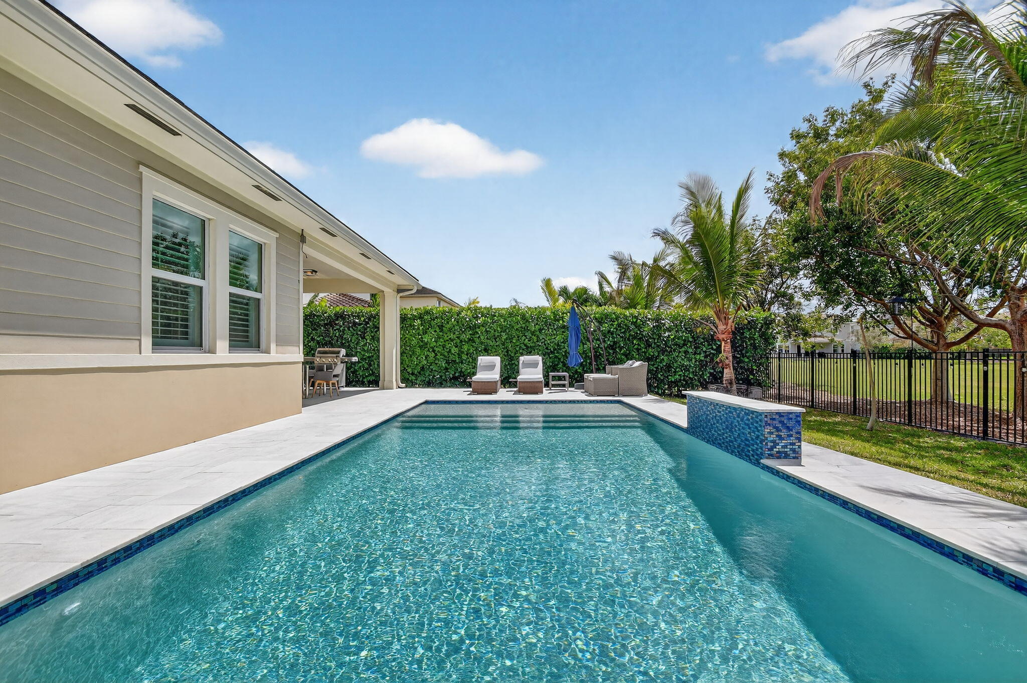 1055 Ember Ridge Run Loxahatchee, FL 33470 - Photo 52 of 103 a view of a house with a yard porch and sitting area