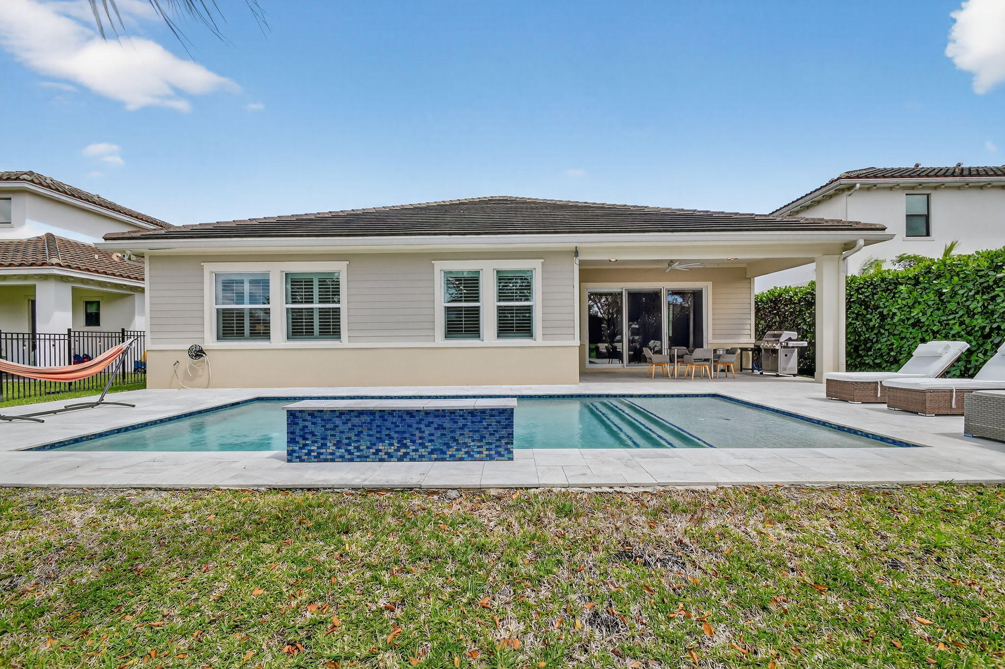 1055 Ember Ridge Run Loxahatchee, FL 33470 - Photo 56 of 103 a view of house with outdoor space and swimming pool