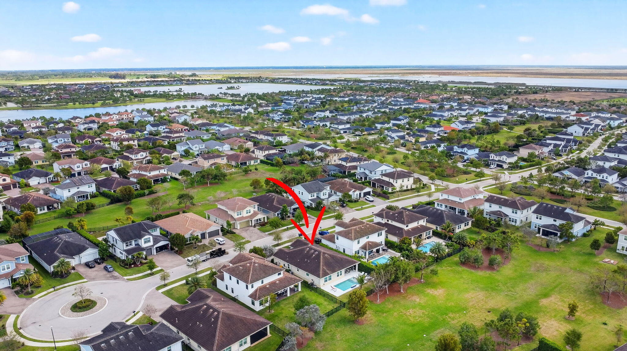 1055 Ember Ridge Run Loxahatchee, FL 33470 - Photo 64 of 103 an aerial view of residential houses with outdoor space