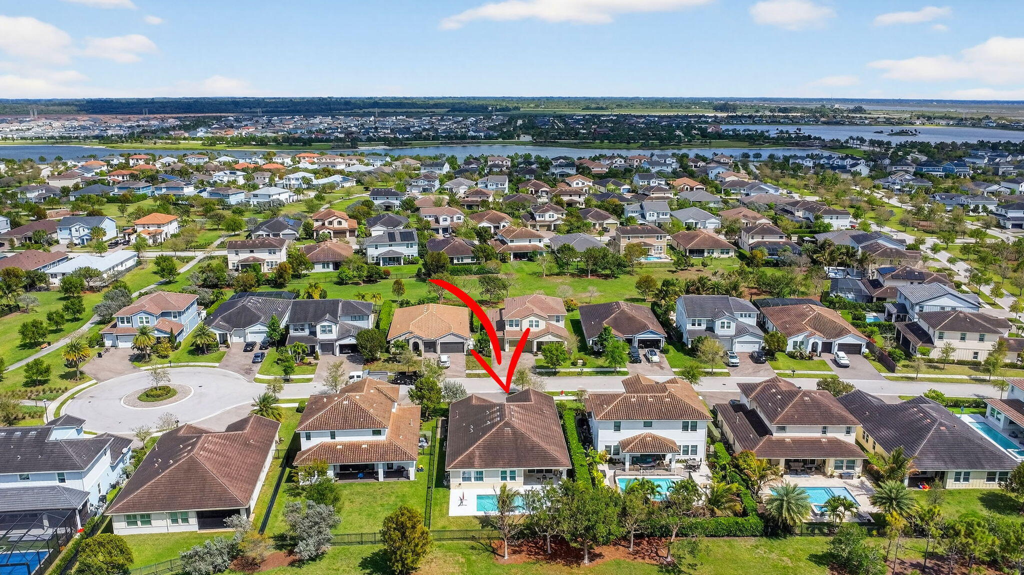 1055 Ember Ridge Run Loxahatchee, FL 33470 - Photo 69 of 103 an aerial view of residential houses with outdoor space