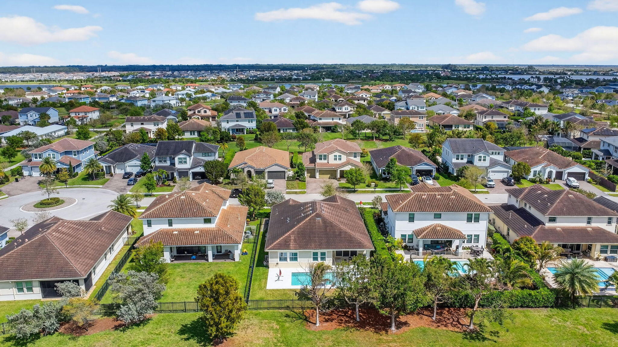 1055 Ember Ridge Run Loxahatchee, FL 33470 - Photo 70 of 103 an aerial view of residential houses with outdoor space