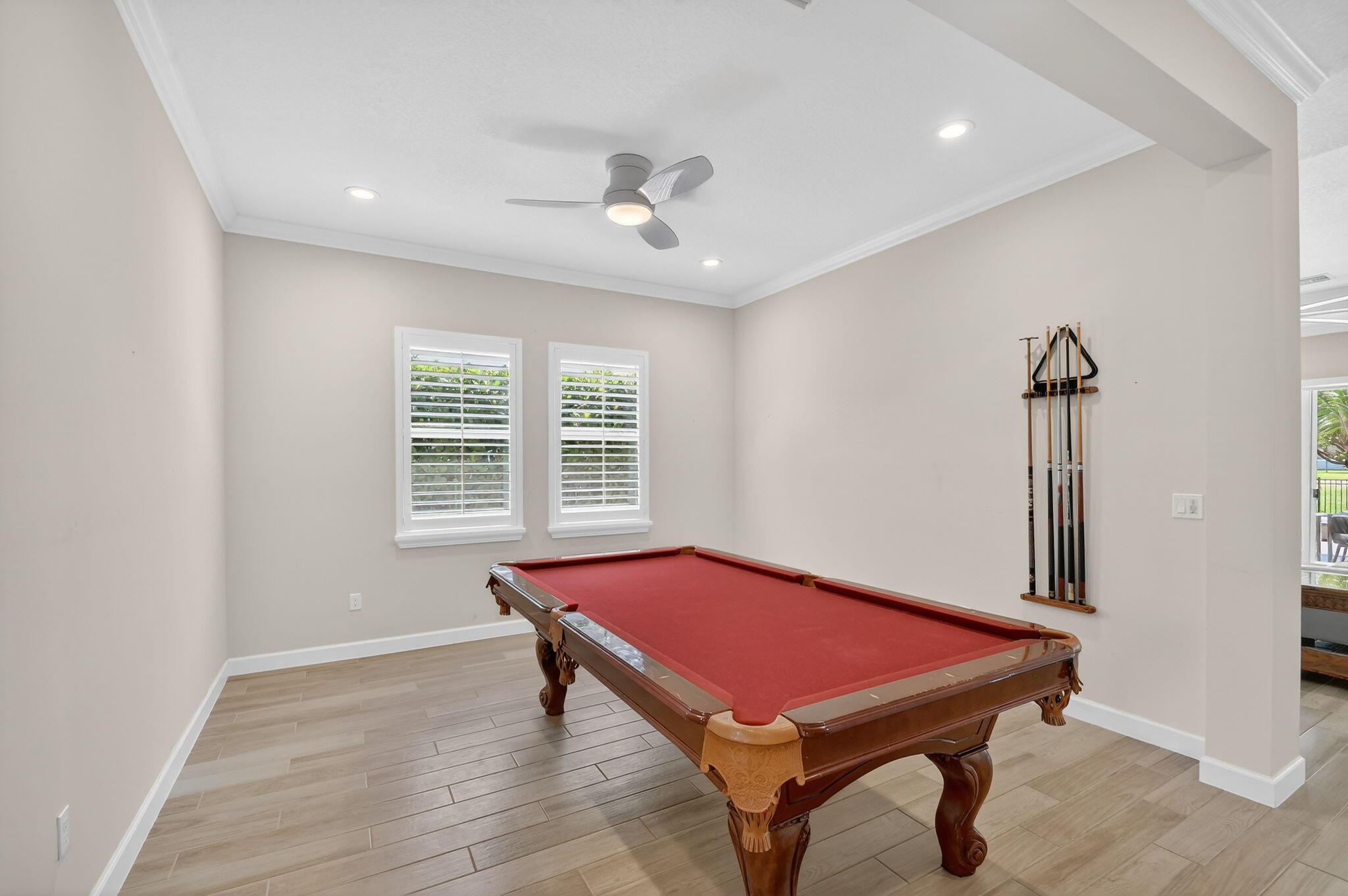 1055 Ember Ridge Run Loxahatchee, FL 33470 - Photo 10 of 103 a room with pool table and windows