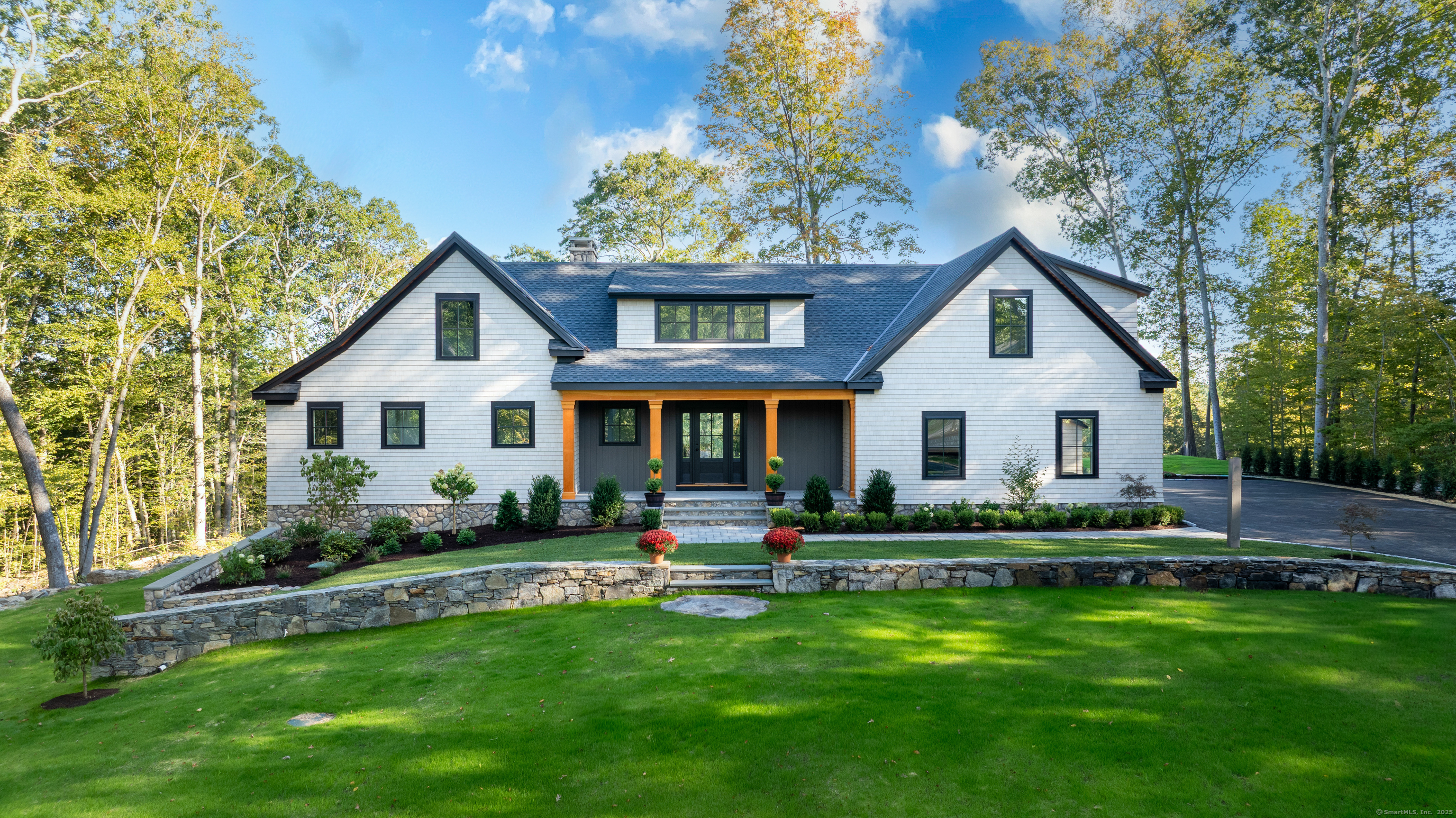 703 Fox Hopyard Road East Haddam, CT 06423 - Photo 1 of 38 a front view of a house with a yard and outdoor seating
