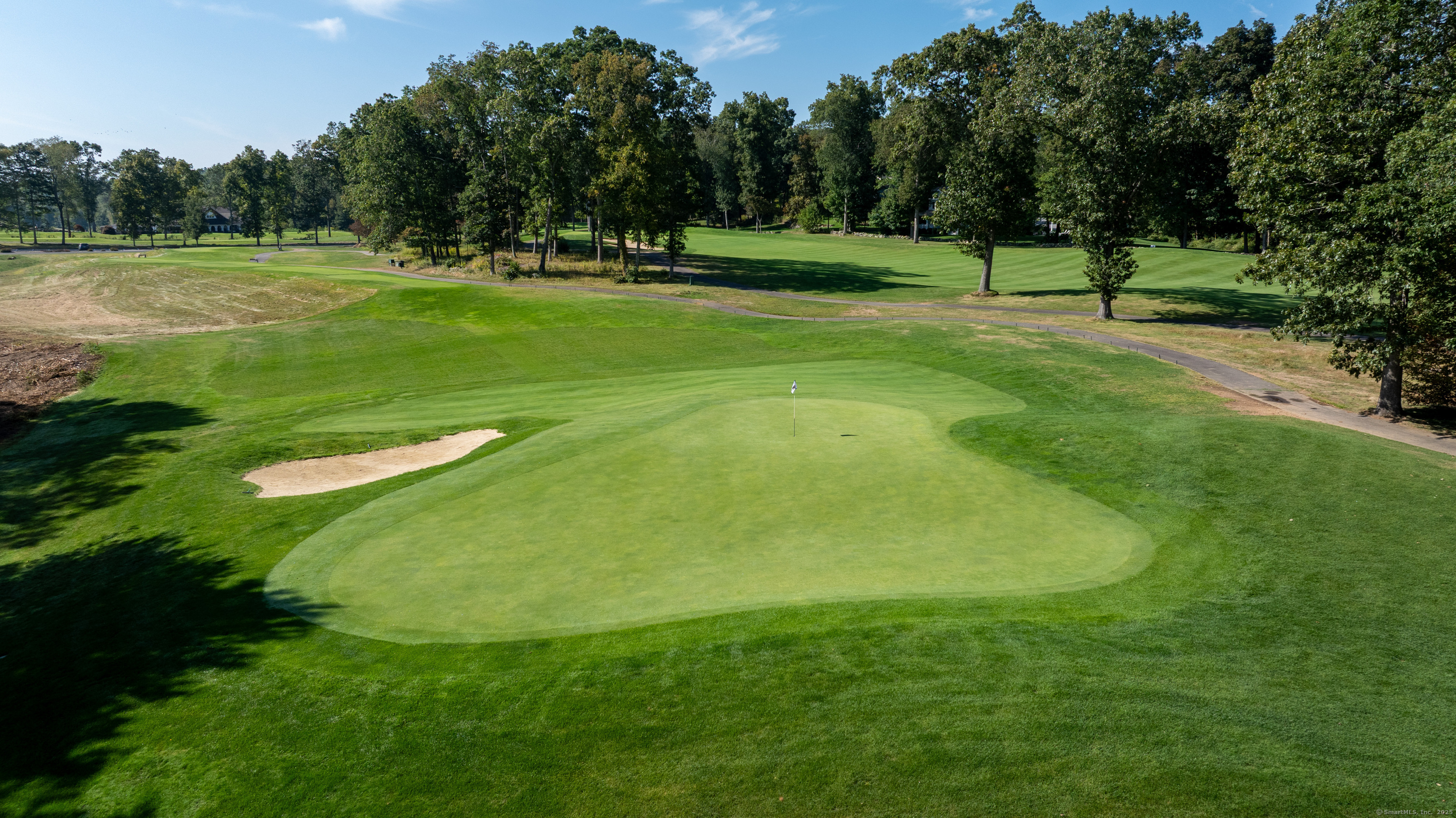 703 Fox Hopyard Road East Haddam, CT 06423 - Photo 17 of 38 a view of a golf course with a play ground