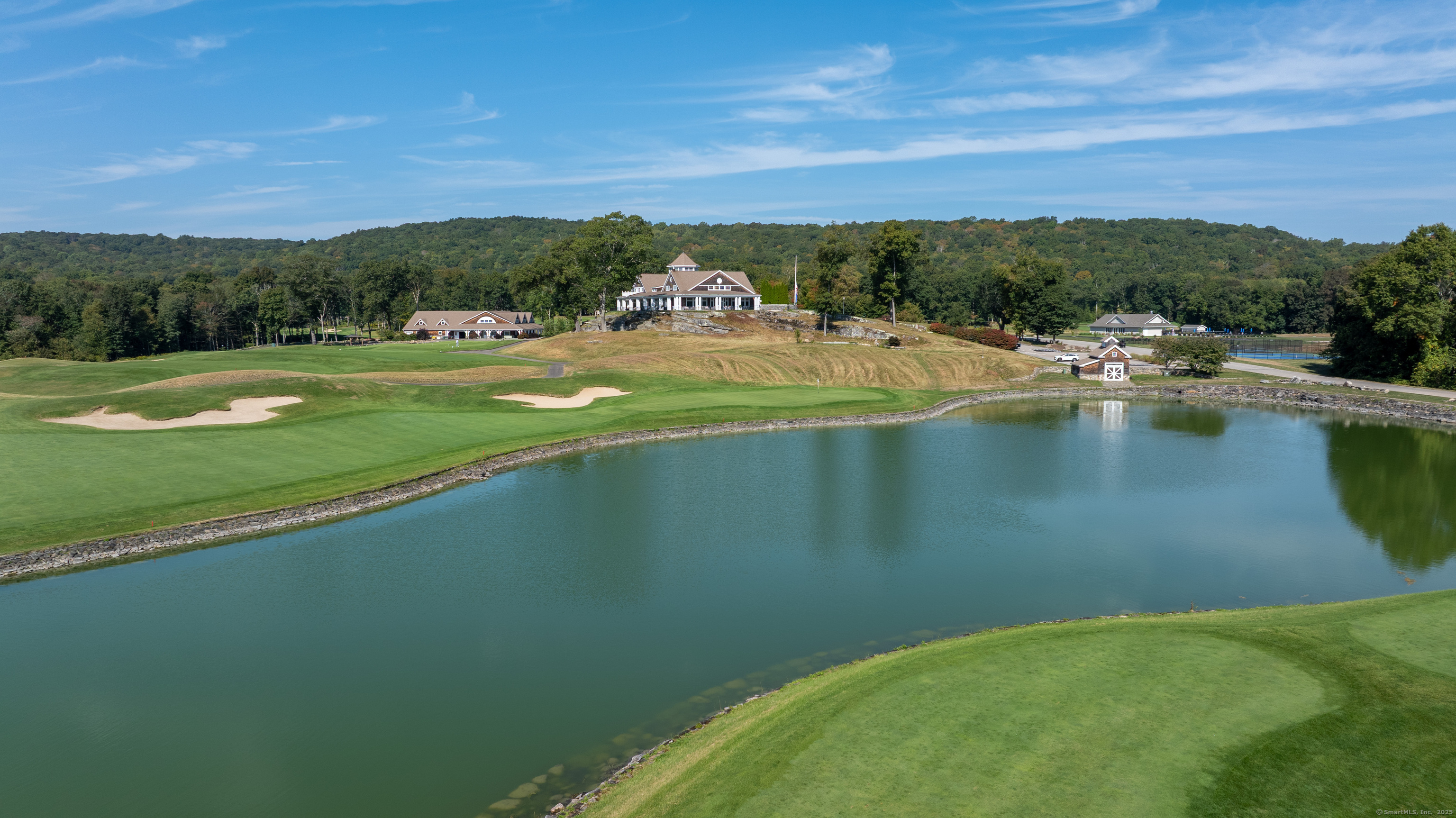 703 Fox Hopyard Road East Haddam, CT 06423 - Photo 25 of 38 a view of a lake with a mountain in the background