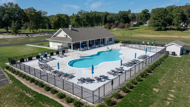 a view of a house with backyard and a mountain