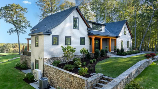 a front view of a house with garden