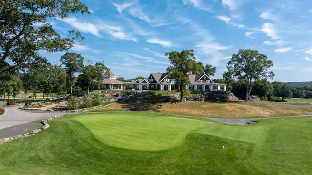 a view of a swimming pool with a yard