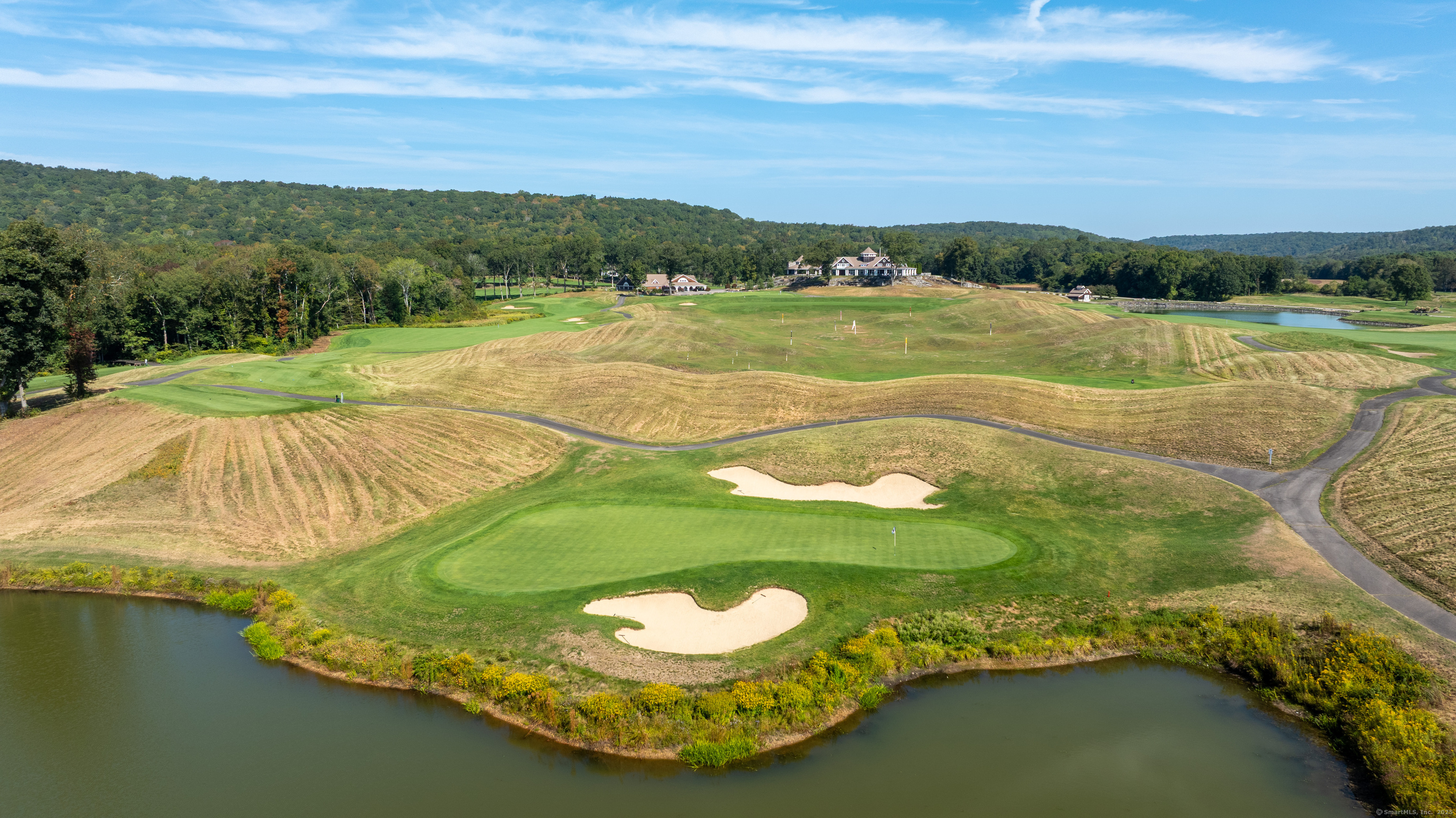 703 Fox Hopyard Road East Haddam, CT 06423 - Photo 36 of 38 a view of a lake with a yard