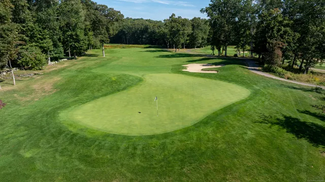 a view of a golf course with a swimming pool