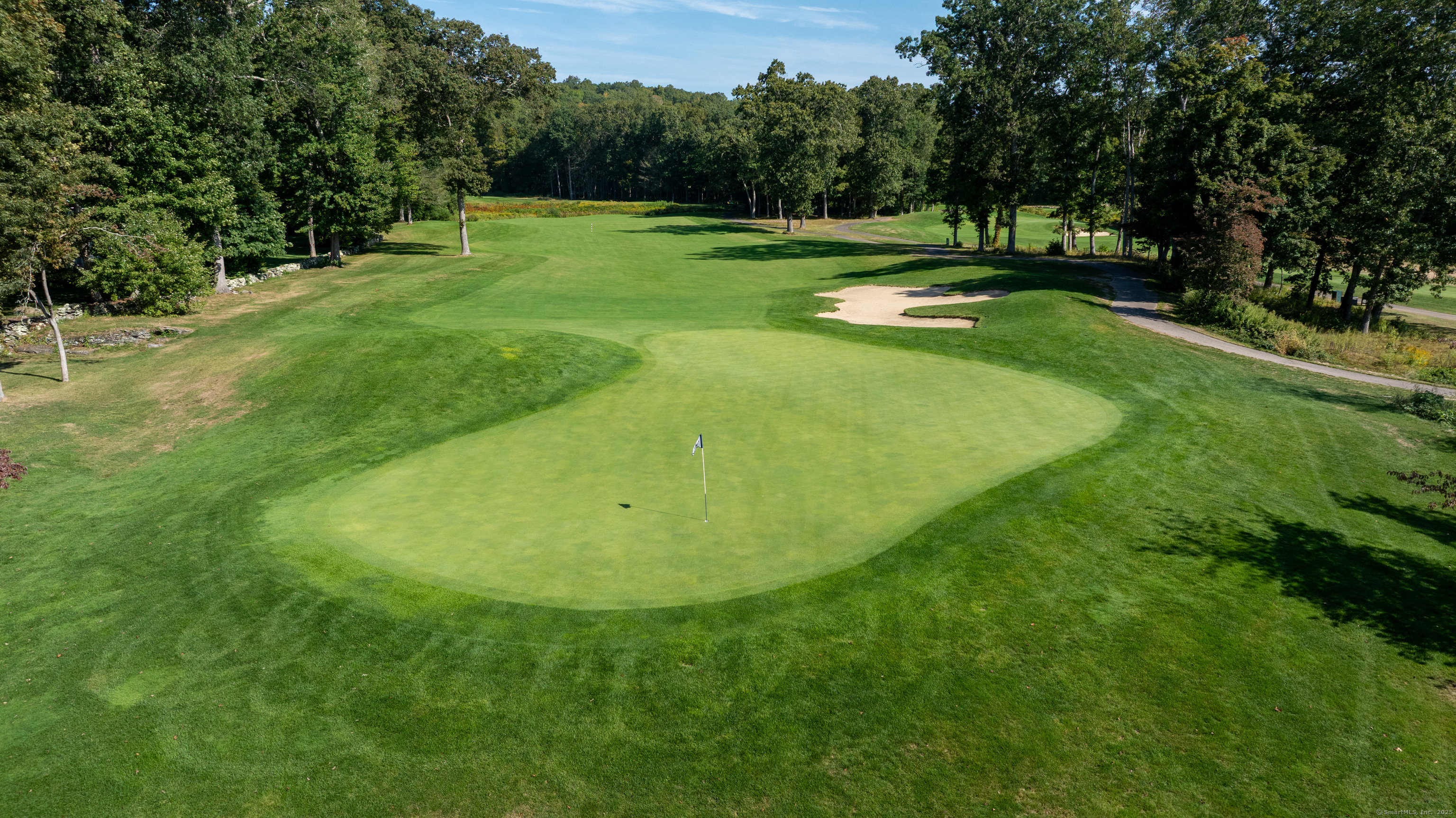 703 Fox Hopyard Road East Haddam, CT 06423 - Photo 38 of 38 a view of a golf course with a swimming pool
