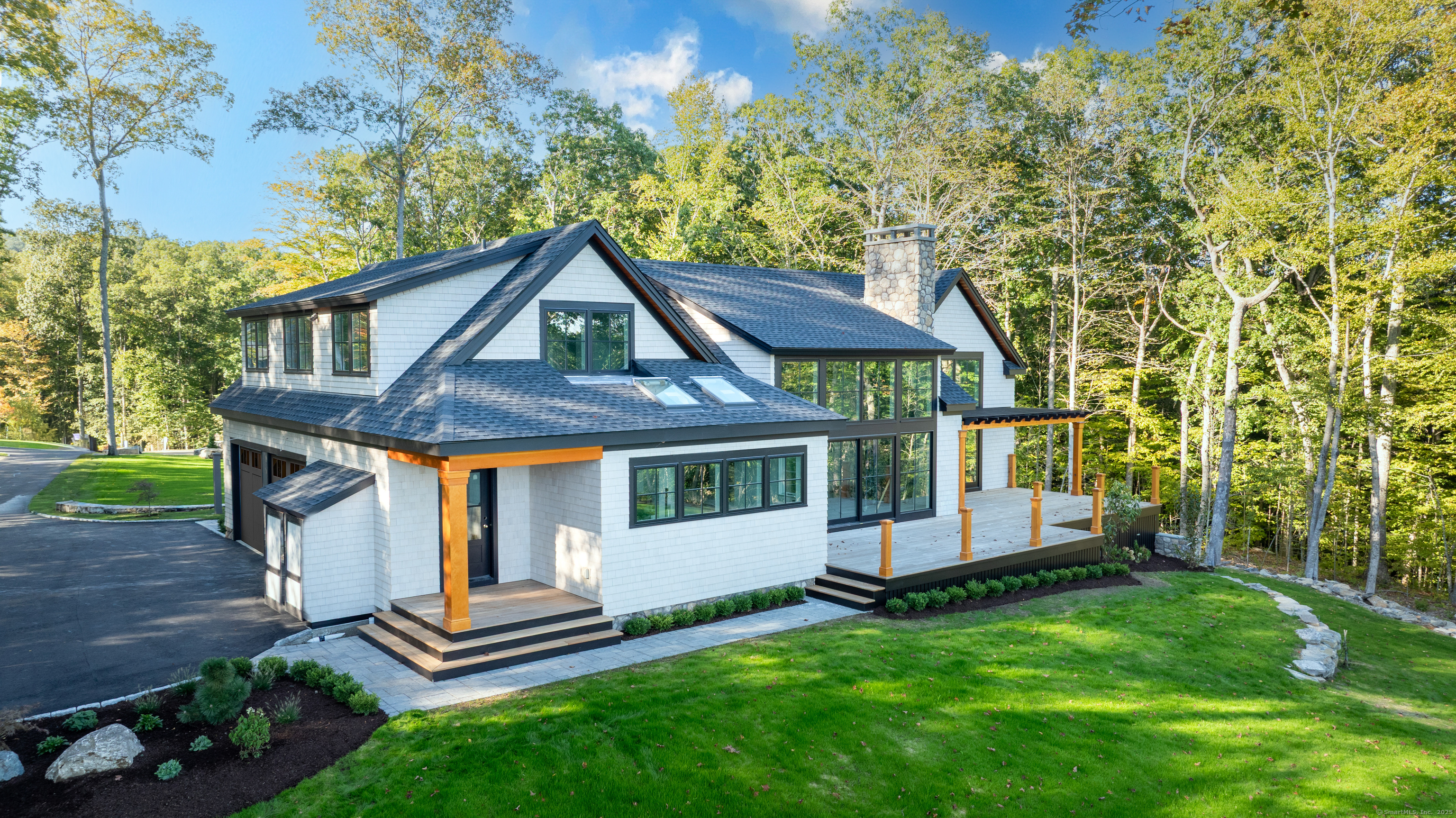 703 Fox Hopyard Road East Haddam, CT 06423 - Photo 6 of 38 a front view of a house with a garden
