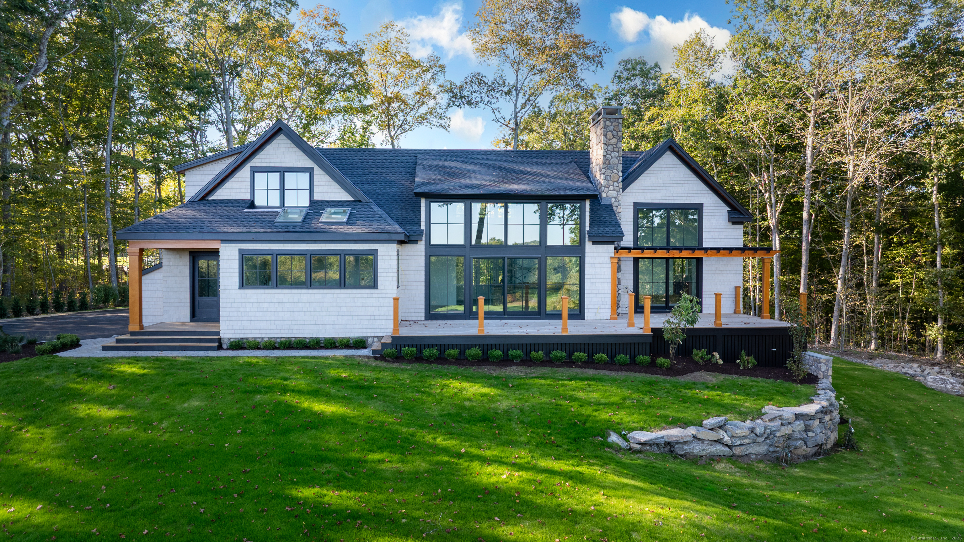 703 Fox Hopyard Road East Haddam, CT 06423 - Photo 7 of 38 a front view of a house with a yard