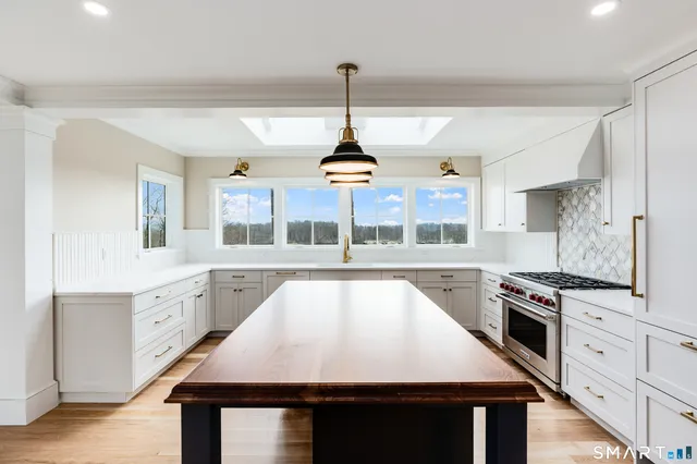 a view of a hallway view with wooden floor and staircase