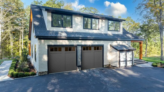 a view of backyard with a barn and a large cactus tree