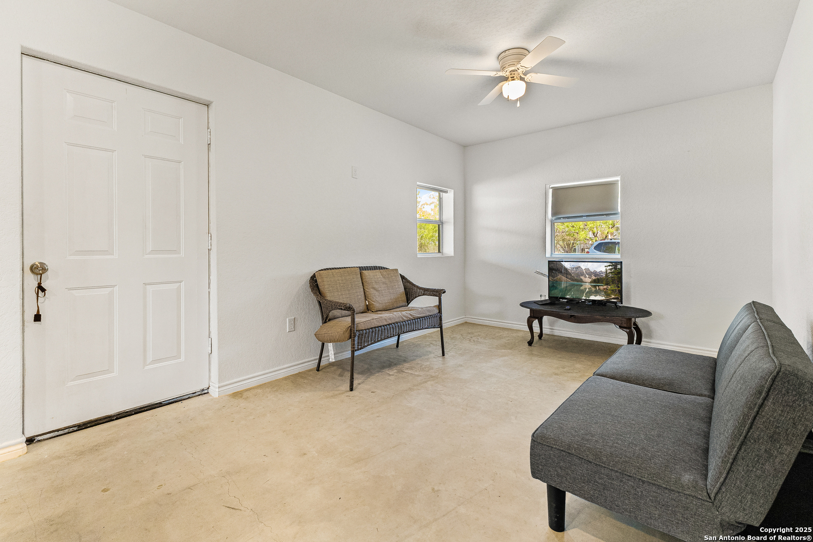 128 County Road 2672 Devine, TX 78016 - Photo 13 of 44 a living room with furniture and a window