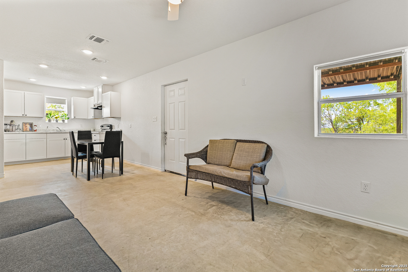 128 County Road 2672 Devine, TX 78016 - Photo 14 of 44 a living room with furniture and a dining table