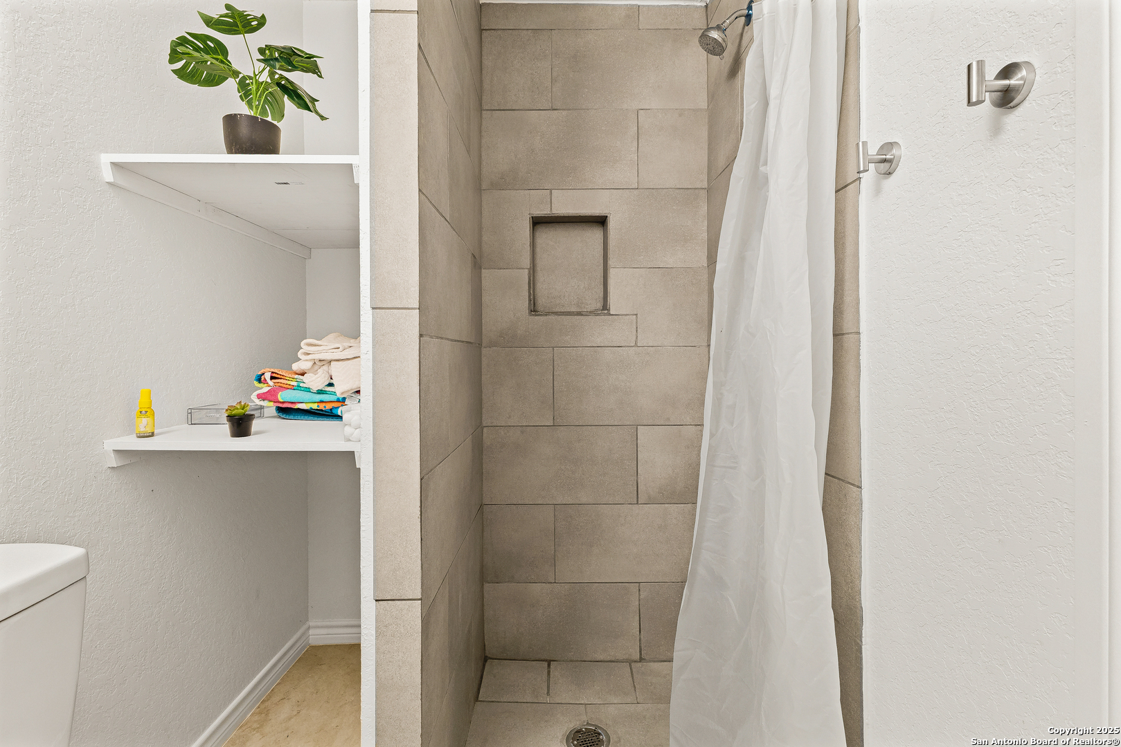 128 County Road 2672 Devine, TX 78016 - Photo 24 of 44 a bathroom with a sink a toilet and shower