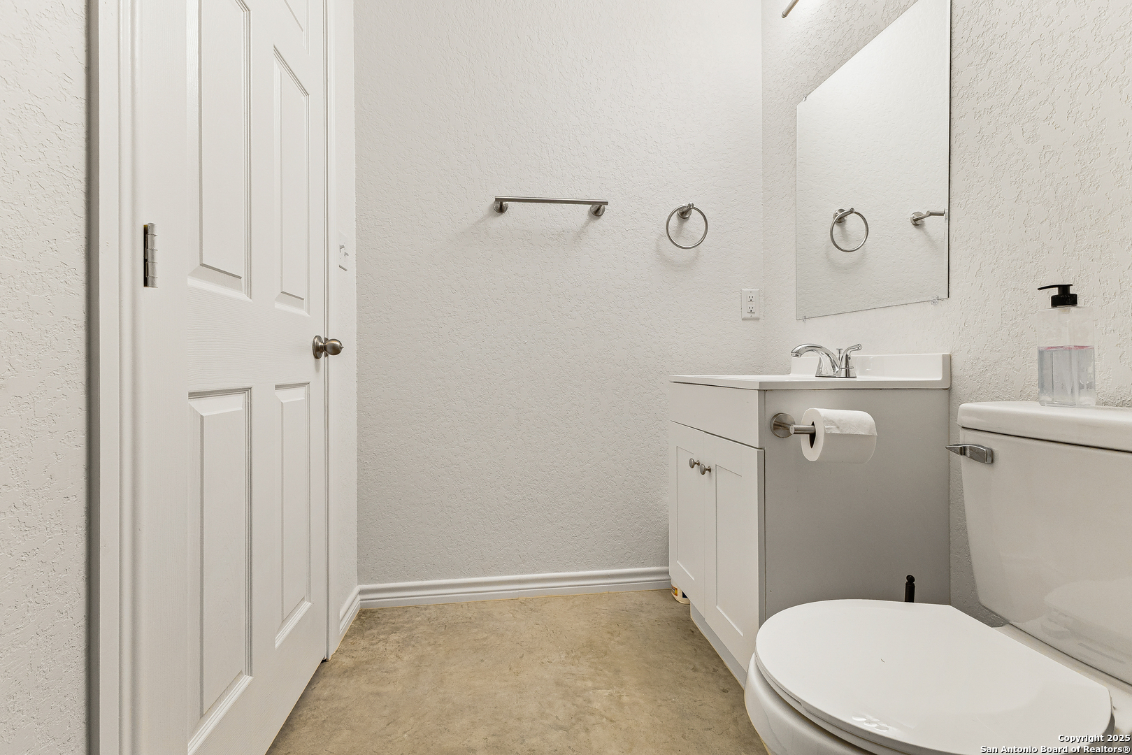 128 County Road 2672 Devine, TX 78016 - Photo 25 of 44 a white toilet sitting next to a bathroom sink
