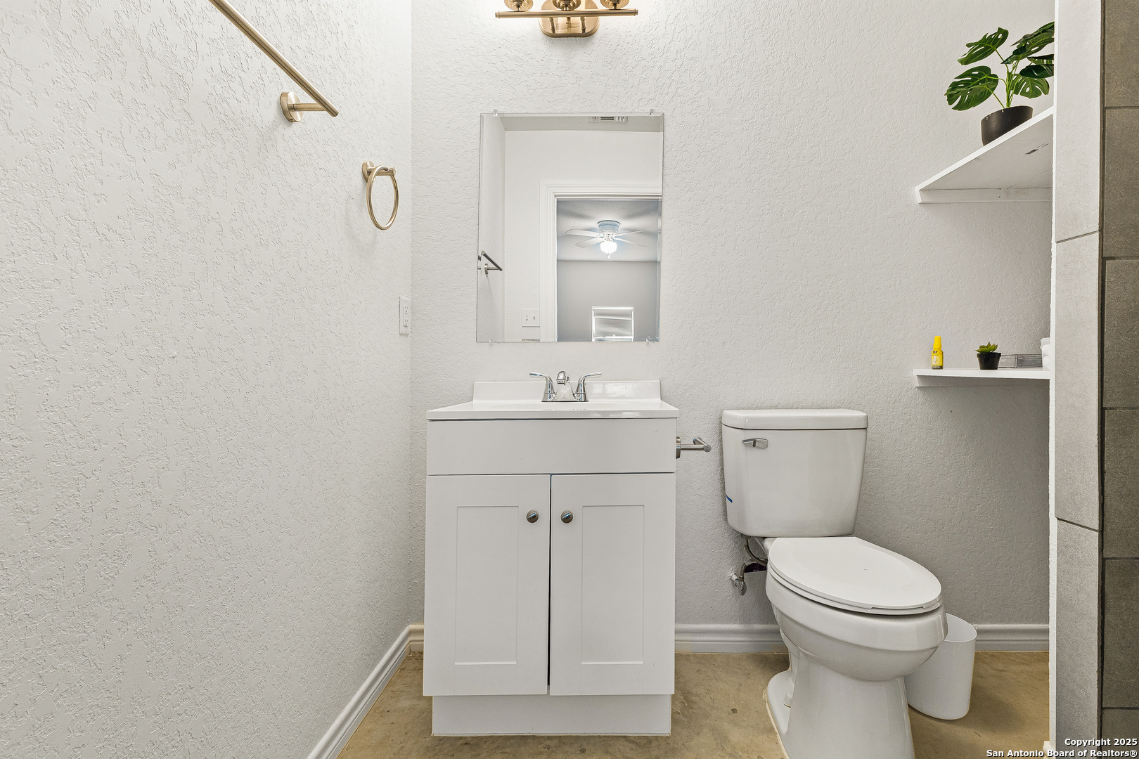 128 County Road 2672 Devine, TX 78016 - Photo 26 of 44 a bathroom with a sink a toilet and shower