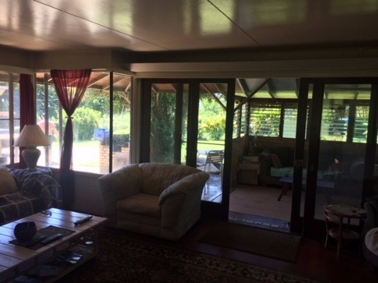 4161 Omao Road Koloa, HI 96756 - Photo 8 of 22 a living room with furniture and a floor to ceiling window