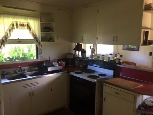 4161 Omao Road Koloa, HI 96756 - Photo 10 of 22 a kitchen that has a sink and a stove