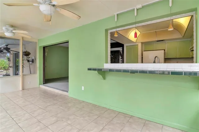 a view of an entryway with a floor to ceiling windows