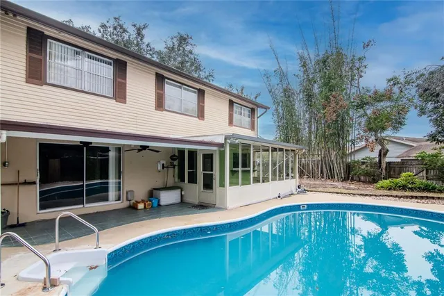 a view of swimming pool with seating space