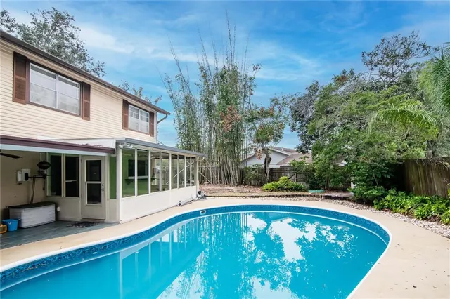 a view of a swimming pool with a patio