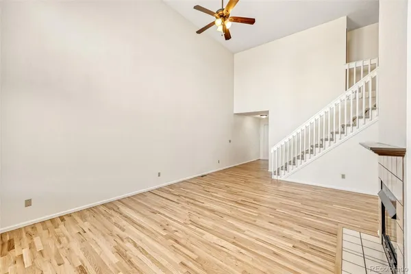 a view of a room with wooden floor