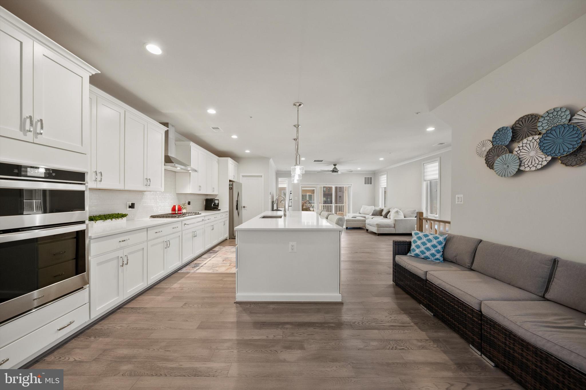 43179 Mongold Square Ashburn, VA 20148 - Photo 12 of 46 a large white kitchen with a large window and stainless steel appliances