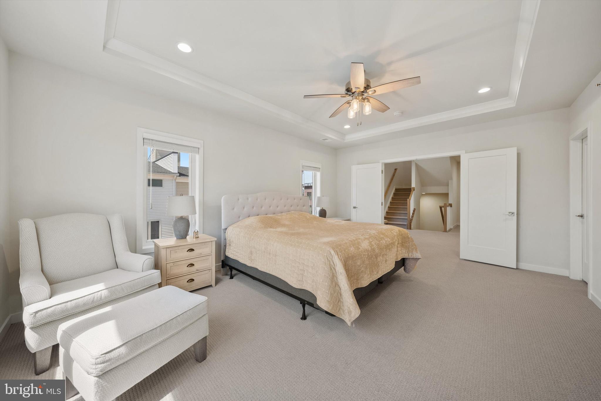 43179 Mongold Square Ashburn, VA 20148 - Photo 18 of 46 a spacious bedroom with a bed and a chandelier