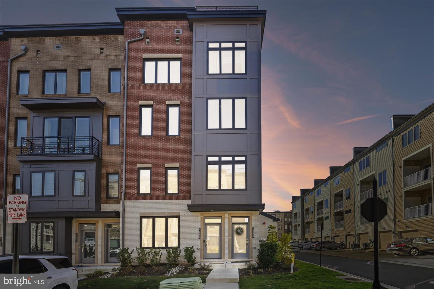 43179 Mongold Square Ashburn, VA 20148 - Photo 35 of 46 a front view of a residential apartment building with a yard