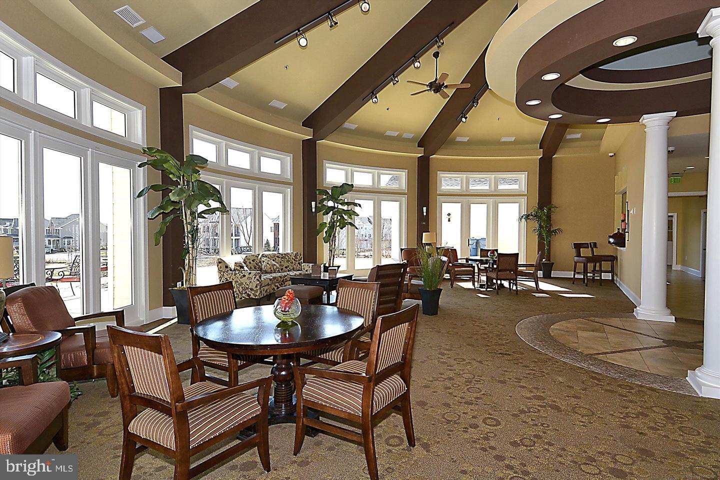 43179 Mongold Square Ashburn, VA 20148 - Photo 38 of 46 a dining room with furniture a chandelier and wooden floor