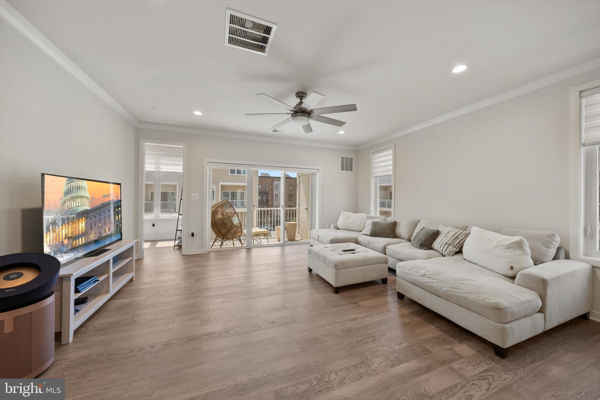 43179 Mongold Square Ashburn, VA 20148 - Photo 6 of 46 a living room with furniture and a flat screen tv