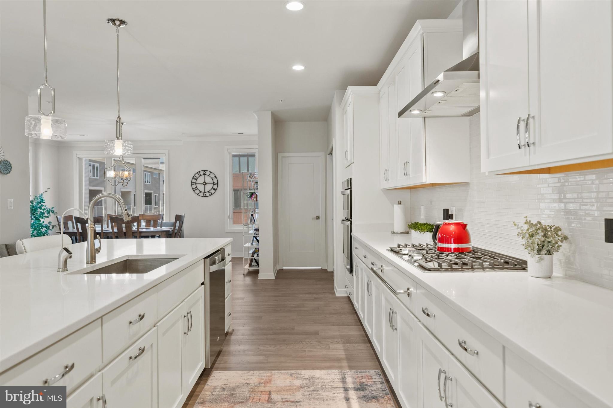 43179 Mongold Square Ashburn, VA 20148 - Photo 9 of 46 a kitchen with stainless steel appliances kitchen island granite countertop a sink and cabinets