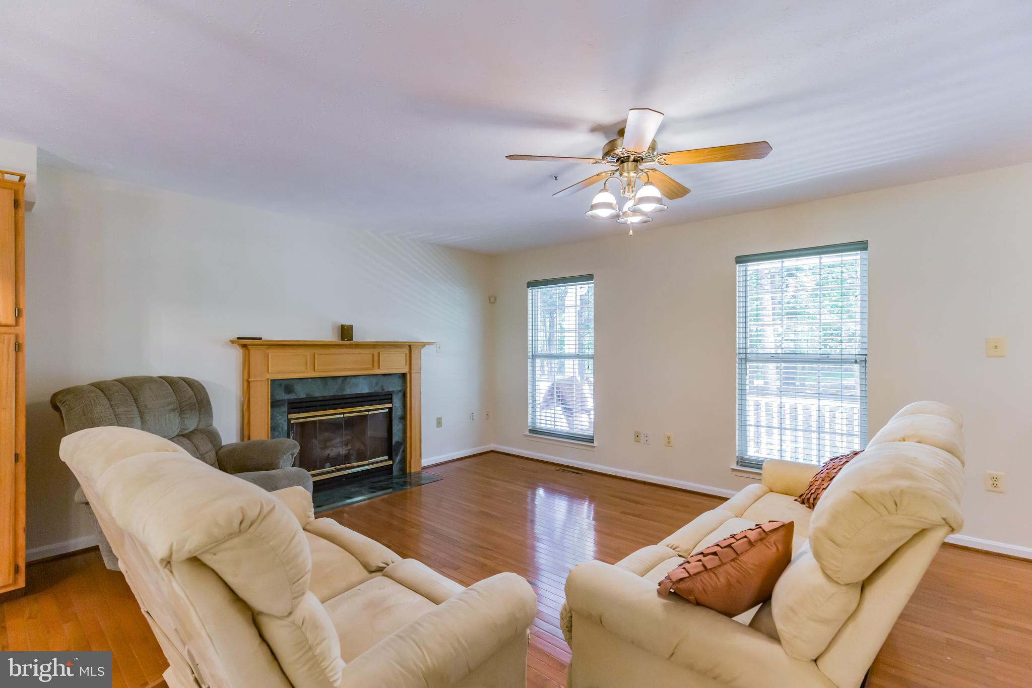 640 Small Reward Road Huntingtown, MD 20639 - Photo 3 of 28 a living room with furniture ceiling fan and a window