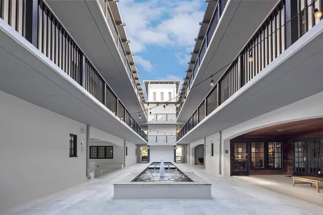 a view of a garden with lawn chairs