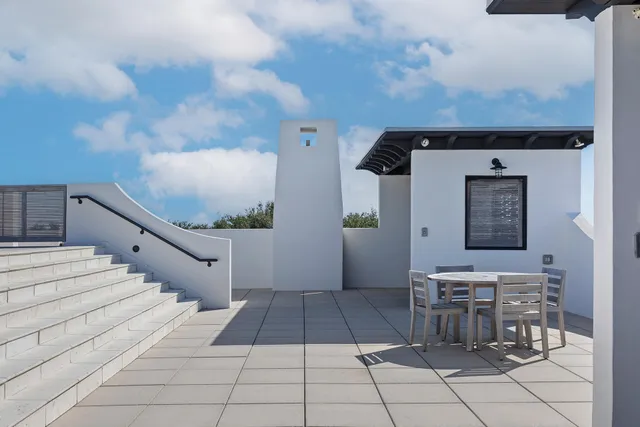 a view of a terrace with furniture