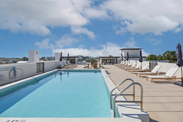 a view of a swimming pool from a balcony